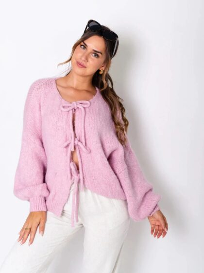 Women's pink chunky oversized cardigan with tie-front design and long sleeves, ideal for layering and cold weather.