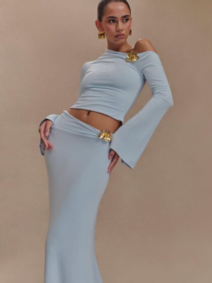 Asymmetrical long-sleeve top and floor-length skirt with floral details from the Celeste Evening Set.